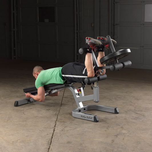 Leg Curls on the Body-Solid Commercial Leg Developer Attachment with optional weights and weight horn