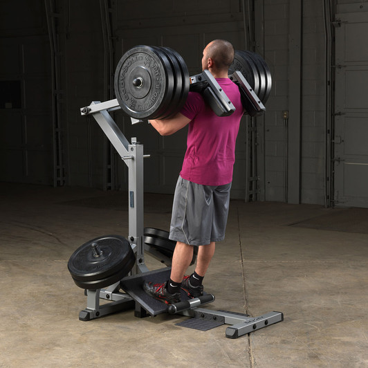 Squats on the Body-Solid Leverage Squat Calf Machine