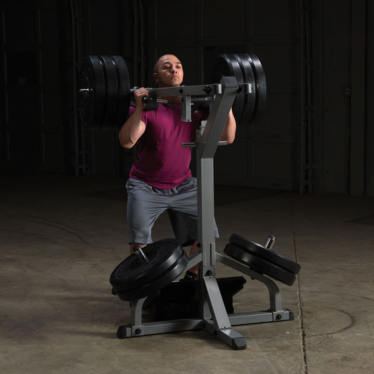 Squats on the Body-Solid Leverage Squat Calf Machine